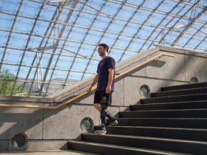 Mr. Cetindag walking down the stairs in Leipzig Messe with Intuy Knee